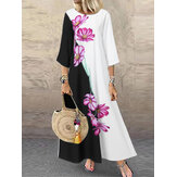 Vestido maxi casual de manga 3/4 e decote redondo com estampa floral em cores contrastantes