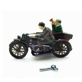 Motocicleta con pasajero en una sidecar juguete retro de cuerda con caja